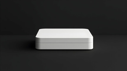 Minimalist white square device on black background.