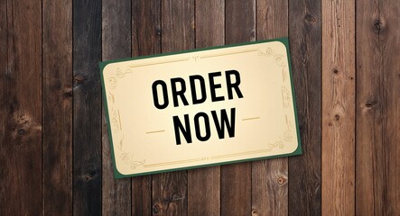Obraz premium Order now lettering on card with wooden background