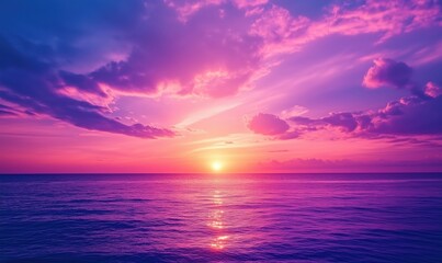 Vibrant sunset over ocean, colorful sky with pink and purple hues, calm water reflecting light, serene atmosphere