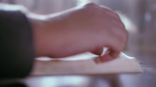 Reflective Bible Study: Woman Immersed in Thoughtful Page-Turning