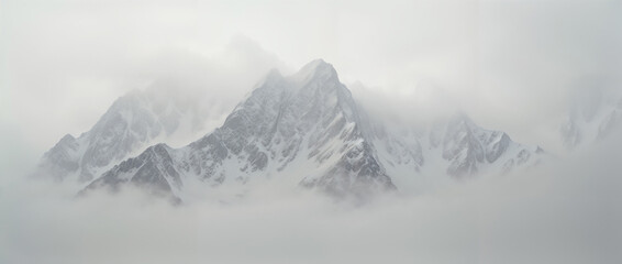 Obraz premium Mystical Mountain Range Shrouded in Morning Fog Creates Ethereal Dreamlike Landscape