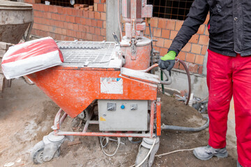 An automatic mixer for mixing dry plaster with water and automatically feeding the finished...