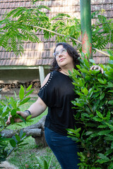 Plus size woman in her 40s posing sensually
