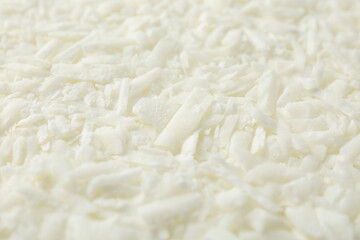 White soy wax flakes as background, closeup