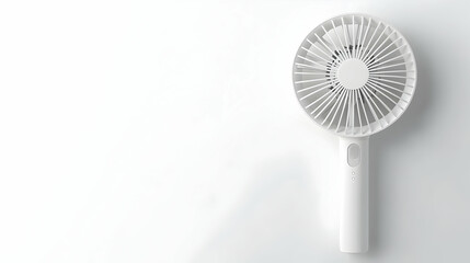 White portable desk fan on white background.