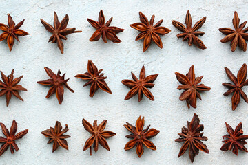 Composition with aromatic star anise on light background