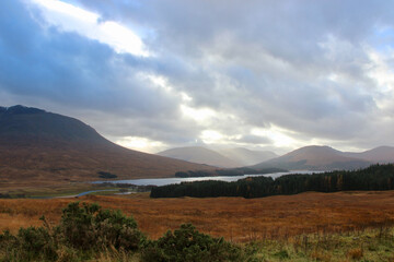 rural scottish scenery in the highlands during autumn with cloudy skies