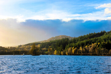 loch ness scenery in scotland, majestic lake with rolling hills in the background