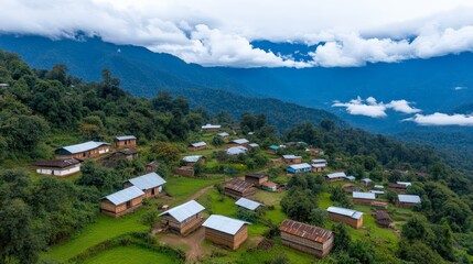 Serene Mountain Village: An aerial view captures a picturesque village nestled in lush green mountains, with traditional houses dotting the hillside under a cloudy sky.
