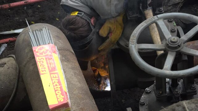 August 13, 2020 - Artem, Russia - Heating main repair. Workers are repairing the heating main.