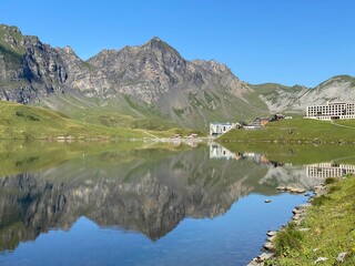 Fototapeta premium The alpine lake Melchsee or Melch Lake in the Uri Alps mountain massif, Kerns - Canton of Obwald, Switzerland (Kanton Obwalden, Schweiz)