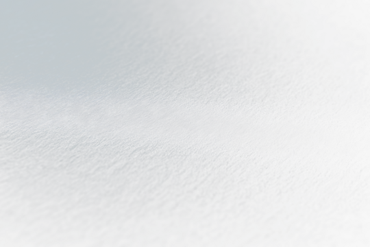 Close-up of dark textured surface with subtle light.