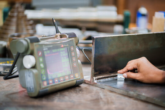 UT, Ultrasonic testing to detect imperfection or defect in welding of steel plate fillet joint coupon for welder test quanlified . NDT Inspection.