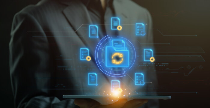 File Backup icon, Document Management concept for system or process used to capture, track and store electronic documents. Businessman shows documents and folder icon with cycle sign on virtual screen