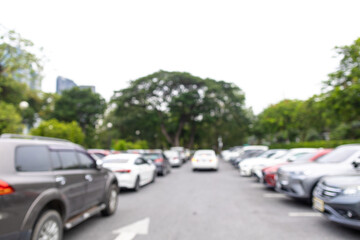 Abstract blurred outdoor car parking lot in city park