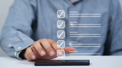 A person using a smartphone with virtual checklists, showcasing task management and digital efficiency in a modern workspace.