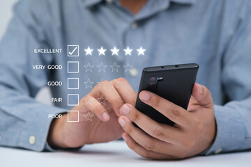 Person using smartphone to give feedback with a rating system, showcasing engagement and digital interaction.