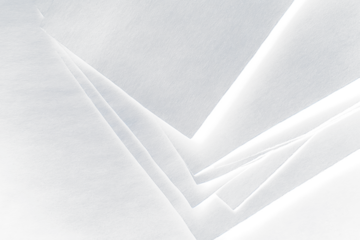 Stack of dark gray textured sheets.