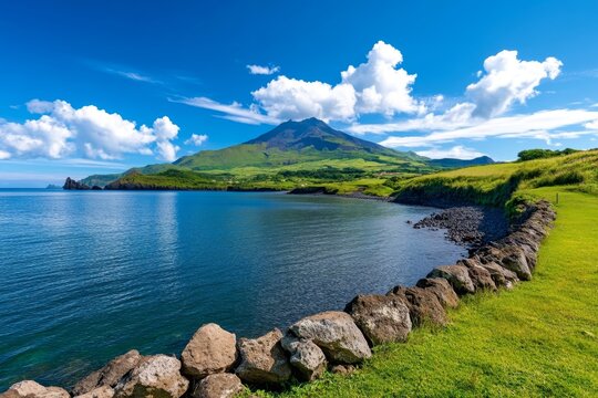 A panoramic view of Capelinhos Volcano on Faial Island, with its stark volcanic landscape meeting the sea