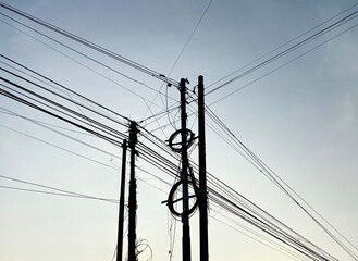 Silhouette of a pole and internet cable installation. Internet network. 