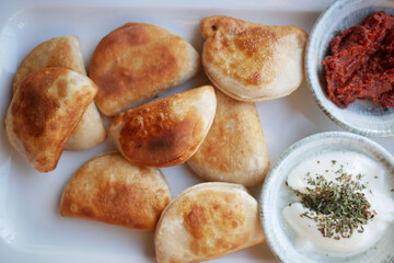 Enjoy Delightfully Delicious Homemade Dumplings Served with a Variety of Tasty Sauces