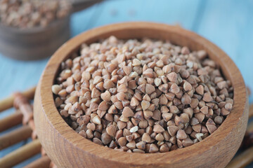 Close-Up of Raw Buckwheat Groats in a Wooden Bowl