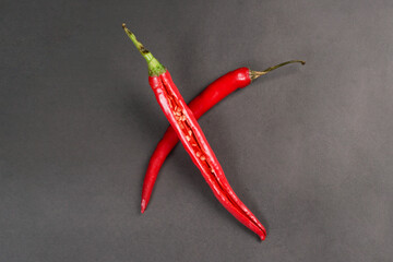 Large red chili served on a black background
