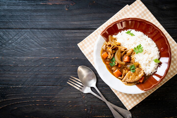 Japanese curry rice with sliced pork, carrot and onions