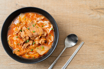 Korean udon ramen noodles with pork in kimchi soup