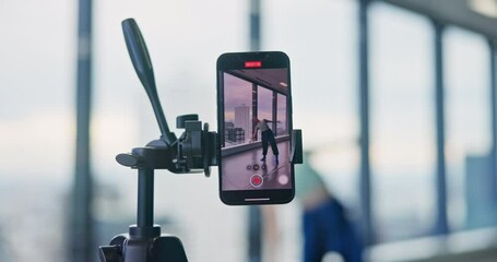 Contemporary, dance and woman in studio with phone screen, live streaming and online tutorial. Streamer, dancer and Japanese girl with video, recording and creative influencer in modern performance