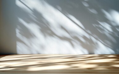 Wooden Surface with Elongated Shadows and Light Gray Wall