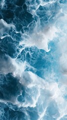 Obraz premium The image is of a beautiful blue ocean with white clouds in the sky