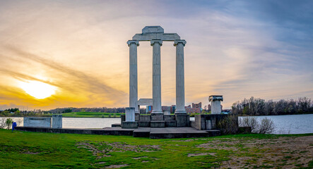 sunset with pillars at lake