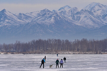 Alaskan families hit the ice on Wasilla Lake for a day of skating and fun.
