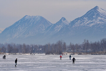 Alaskan families hit the ice on Wasilla Lake for a day of skating and fun.