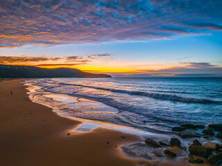 Winter seascape views over the beach with high and medium cloud cover