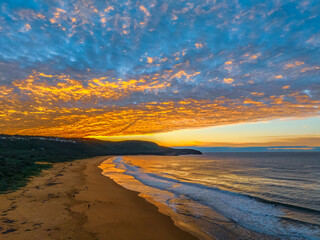Winter seascape views over the beach with high and medium cloud cover