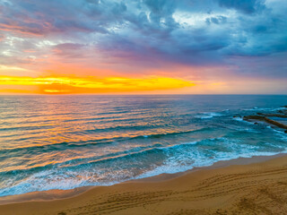 Pretty Sunrise at the seaside with rain clouds