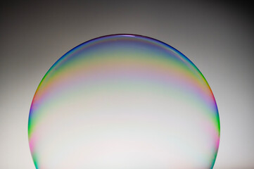 International Blowing Bubbles Day. NATIONAL BUBBLE WEEK. Soap bubbles isolated on a black background. Copy space.