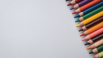 Fototapeta premium Colorful Crayons Laying on a Blank Surface Ready for Creative Artistic Expression, Ideal for Children’s Artwork and Craft Projects with Space for Drawing