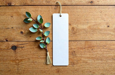 Blank bookmark mockup with brown rope, on wooden background, top view