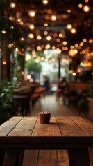 a wooden table with a cupcake on it