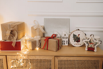 Christmas Gifts and Decorations on a Wooden Cabinet