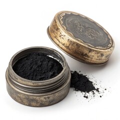 Kohl eyeliner, old make up tool used as eye liner, in an ancient metal package, contain black powder on white background.