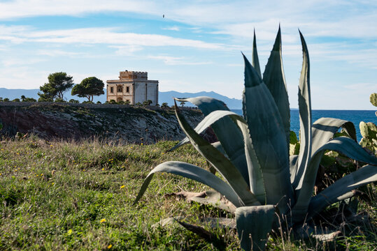 The Tower Alba or Tower of Cala Rossa, is a defense tower on the coast of the Mediterranean sea in Terrasini, province of Palermo, Sicily, Italy