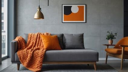 Orange blanket on grey sofa in modern apartment interior with poster and wooden table