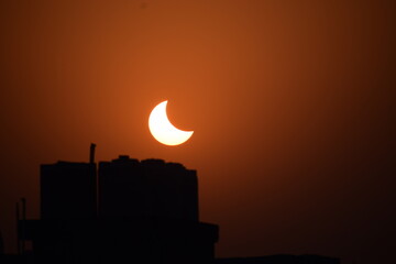 A Shot of a partial solar eclipse during sunset