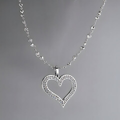 beautiful elegant silver necklace with diamond-studded heart charm/pendant on beaded chain