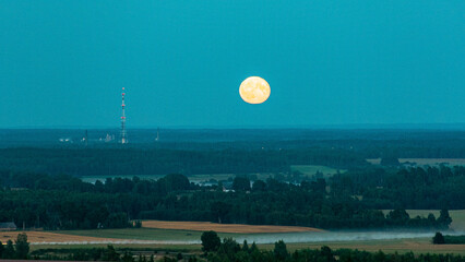 night landscape with round moon, full moon night sky, blurred horizon