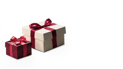 Obraz premium Two elegantly wrapped gifts with maroon and white ribbons.